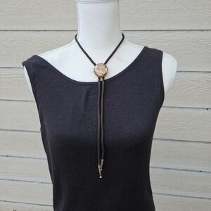 gold leaf and goldstone bolo tie on brown cord